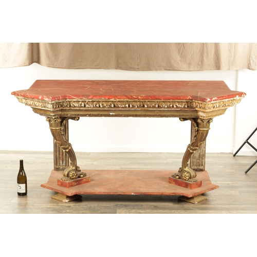 1256 - A STYLISH PAIR OF CARVED GILTWOOD AND SCUMBLED MARBLE CONSOLE TABLES having outset corners raised on... 