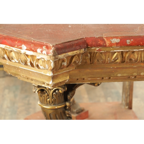 1256 - A STYLISH PAIR OF CARVED GILTWOOD AND SCUMBLED MARBLE CONSOLE TABLES having outset corners raised on... 