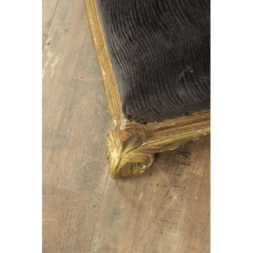 1261 - A 19TH CENTURY CARVED GILT WOOD LONG FOOT STOOL with upholstered top on leaf-carved scrolled feet (1... 