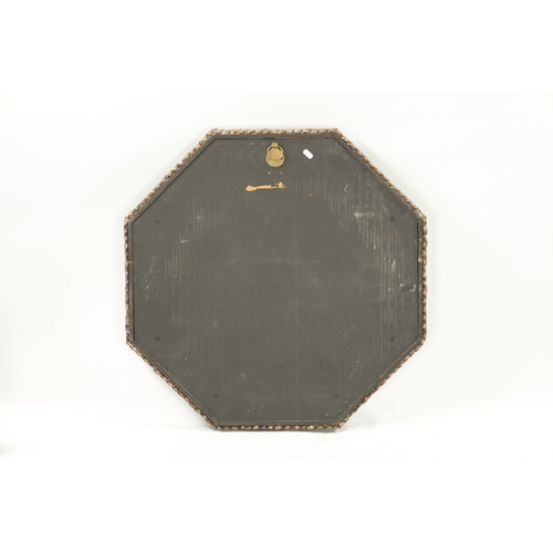 1262 - A DECORATIVE SHELLWORK HANGING MIRROR with octagonal surround and mirror plate (74cm wide )