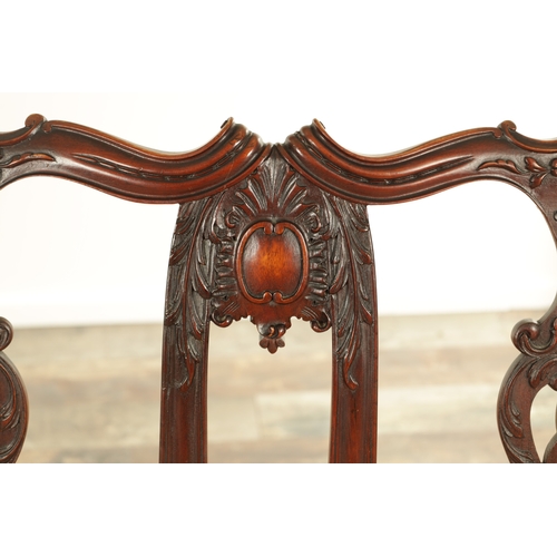 1267 - A 19TH CENTURY CARVED MAHOGANY CHIPPENDALE STYLE TWO SEATER SETTEE with leaf-carved pierced scrolled... 