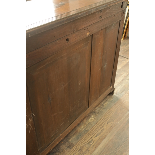 1269 - A LATE REGENCY ROSEWOOD SIDE CABINET with an inverted front having three hinged doors, the centre wi... 