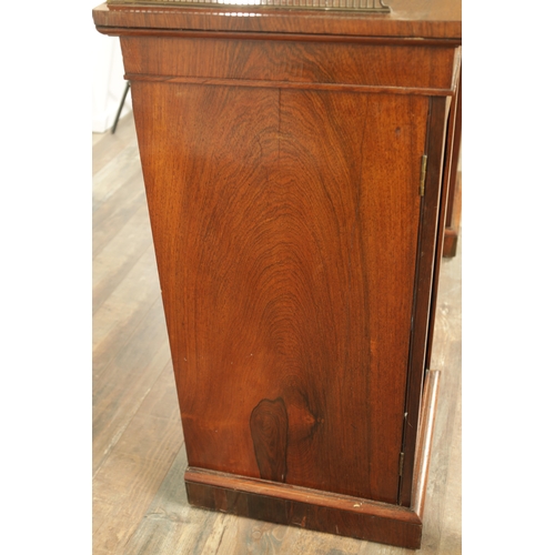 1269 - A LATE REGENCY ROSEWOOD SIDE CABINET with an inverted front having three hinged doors, the centre wi... 