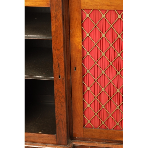 1269 - A LATE REGENCY ROSEWOOD SIDE CABINET with an inverted front having three hinged doors, the centre wi... 