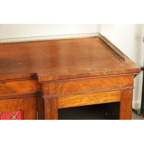 1269 - A LATE REGENCY ROSEWOOD SIDE CABINET with an inverted front having three hinged doors, the centre wi... 