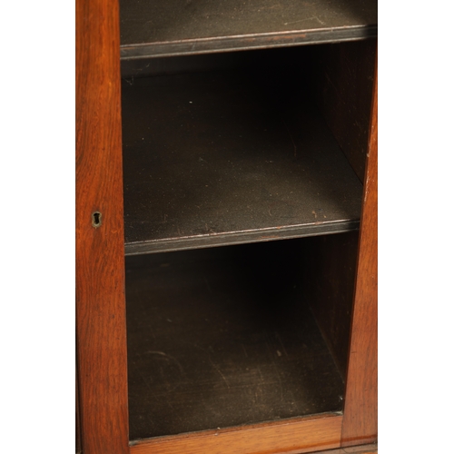 1269 - A LATE REGENCY ROSEWOOD SIDE CABINET with an inverted front having three hinged doors, the centre wi... 