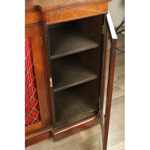 1269 - A LATE REGENCY ROSEWOOD SIDE CABINET with an inverted front having three hinged doors, the centre wi... 