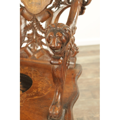 1272 - A 19TH CENTURY CARVED WALNUT AND MARQUETRY INLAID BLACK FOREST ARMCHAIR having lions head arm suppor... 