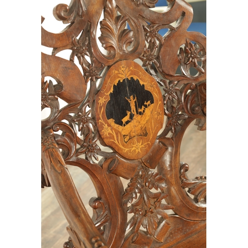 1272 - A 19TH CENTURY CARVED WALNUT AND MARQUETRY INLAID BLACK FOREST ARMCHAIR having lions head arm suppor... 