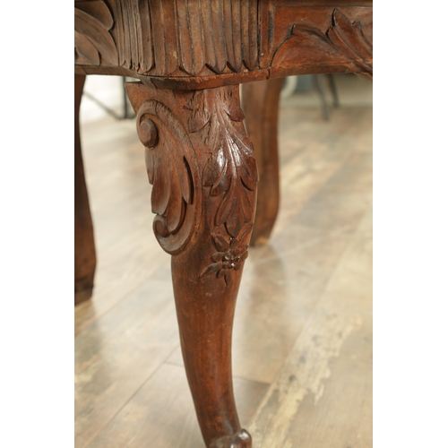 1272 - A 19TH CENTURY CARVED WALNUT AND MARQUETRY INLAID BLACK FOREST ARMCHAIR having lions head arm suppor... 