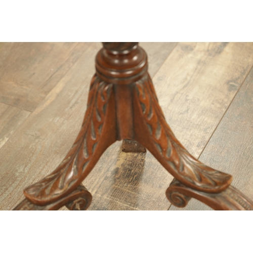 1276 - A LATE 19TH CENTURY MAHOGANY OCCASIONAL TABLE with an inlaid circular top above a leaf-carved tripod... 