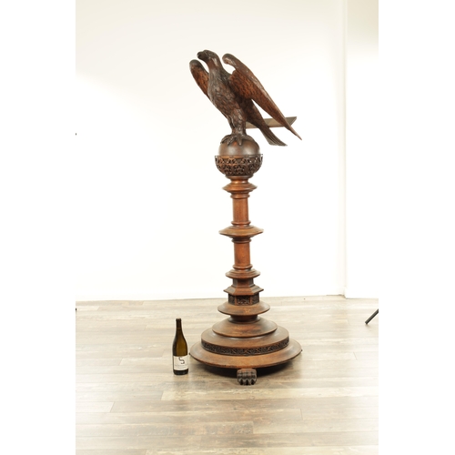 1277 - AN EARLY 20TH CENTURY CARVED OAK LECTERN with finely carved eagle stood on a leaf carved ball and ri... 