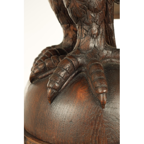 1277 - AN EARLY 20TH CENTURY CARVED OAK LECTERN with finely carved eagle stood on a leaf carved ball and ri... 