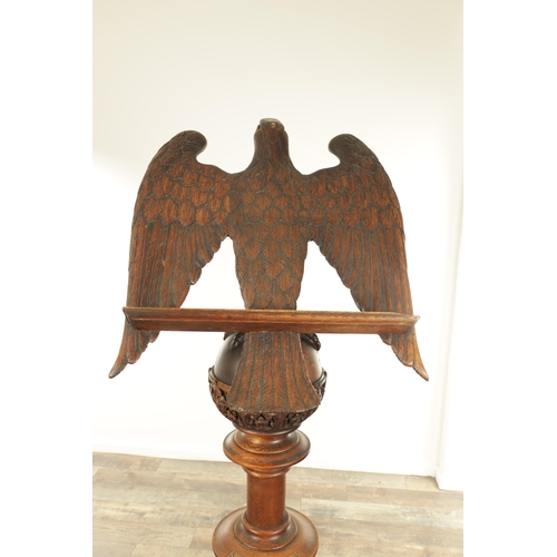 1277 - AN EARLY 20TH CENTURY CARVED OAK LECTERN with finely carved eagle stood on a leaf carved ball and ri... 