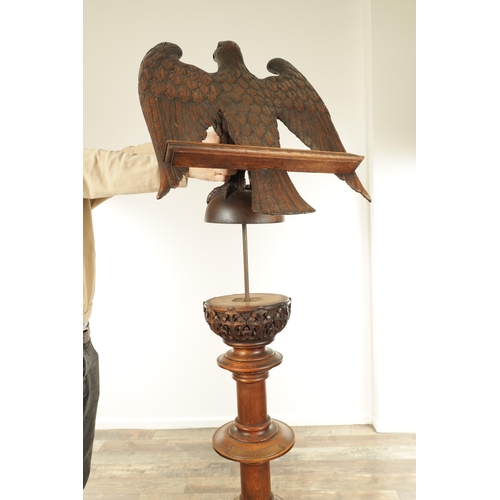 1277 - AN EARLY 20TH CENTURY CARVED OAK LECTERN with finely carved eagle stood on a leaf carved ball and ri... 