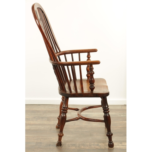 1290 - AN EARLY 19TH CENTURY NOTTINGHAMSHIRE YEW WOOD HIGH BACK WINDSOR CHAIR with hooped back and shaped p... 