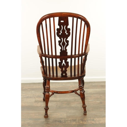 1290 - AN EARLY 19TH CENTURY NOTTINGHAMSHIRE YEW WOOD HIGH BACK WINDSOR CHAIR with hooped back and shaped p... 