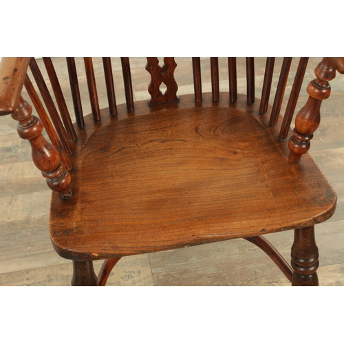 1290 - AN EARLY 19TH CENTURY NOTTINGHAMSHIRE YEW WOOD HIGH BACK WINDSOR CHAIR with hooped back and shaped p... 