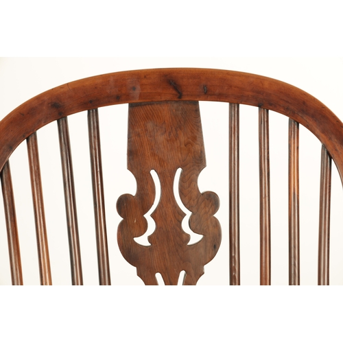 1290 - AN EARLY 19TH CENTURY NOTTINGHAMSHIRE YEW WOOD HIGH BACK WINDSOR CHAIR with hooped back and shaped p... 