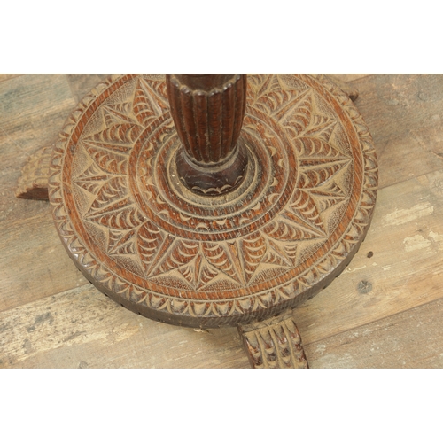 1294 - A LATE 19TH CENTURY CARVED OAK OCCASIONAL TABLE with floral and leaf work decoration (82cm high 23cm... 