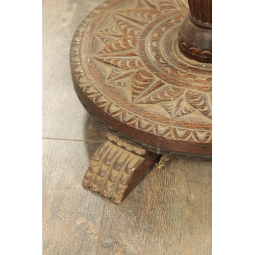 1294 - A LATE 19TH CENTURY CARVED OAK OCCASIONAL TABLE with floral and leaf work decoration (82cm high 23cm... 