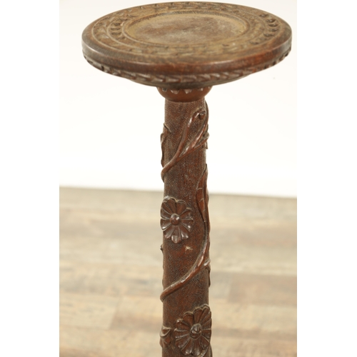 1294 - A LATE 19TH CENTURY CARVED OAK OCCASIONAL TABLE with floral and leaf work decoration (82cm high 23cm... 