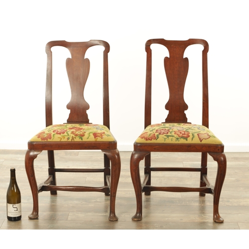 1296 - A PAIR OF EARLY 18TH CENTURY WALNUT SIDE CHAIRS the shaped frames and solid vase-shaped splats above... 