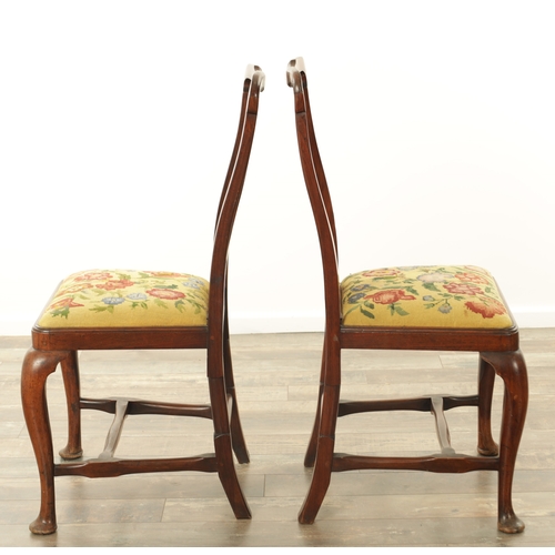 1296 - A PAIR OF EARLY 18TH CENTURY WALNUT SIDE CHAIRS the shaped frames and solid vase-shaped splats above... 