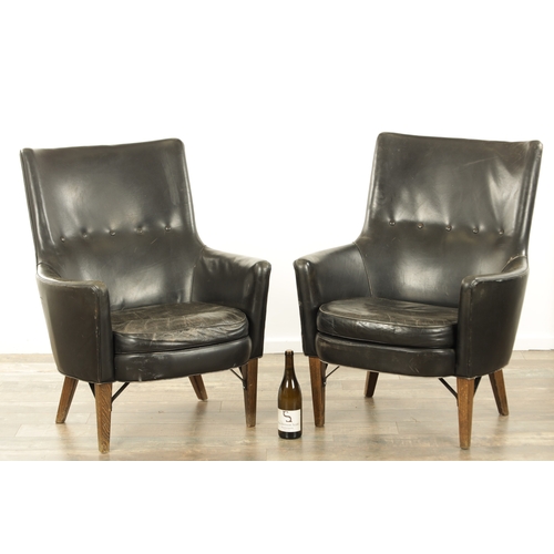 1299 - A PAIR VINTAGE 1970'S SWEDISH BLACK LEATHER ARMCHAIRS BY ARNE NORELL with label underneath Mobel AB ... 