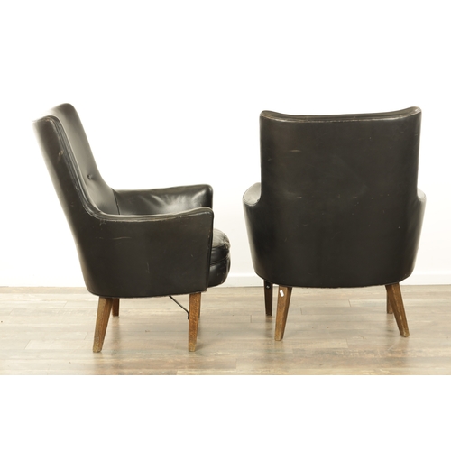 1299 - A PAIR VINTAGE 1970'S SWEDISH BLACK LEATHER ARMCHAIRS BY ARNE NORELL with label underneath Mobel AB ... 