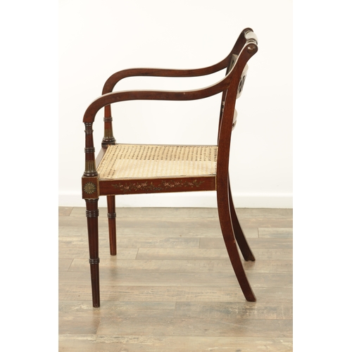 1303 - A GEORGE III PAINTED MAHOGANY BERGERE OPEN ARMCHAIR decorated with floral sprays bearing the portrai... 