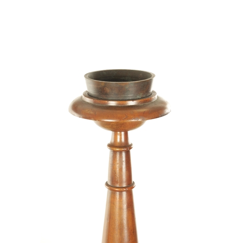 1304 - A PAIR OF 20TH CENTURY WALNUT TORCHERES with bulbous turned stem and raised on triform bases with cl... 