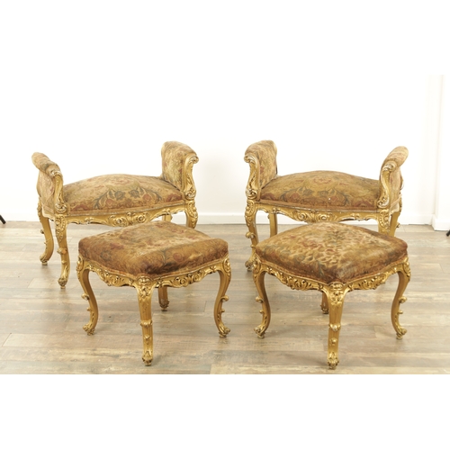 1305 - A SUITE OF FOUR CARVED GILTWOOD ROCOCO STYLE STOOLS comprising two window seats and two square stool... 