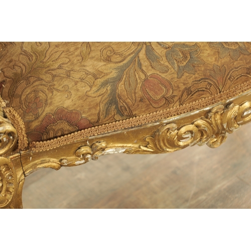 1305 - A SUITE OF FOUR CARVED GILTWOOD ROCOCO STYLE STOOLS comprising two window seats and two square stool... 