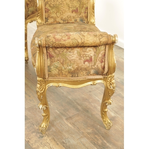 1305 - A SUITE OF FOUR CARVED GILTWOOD ROCOCO STYLE STOOLS comprising two window seats and two square stool... 