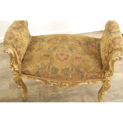 1305 - A SUITE OF FOUR CARVED GILTWOOD ROCOCO STYLE STOOLS comprising two window seats and two square stool... 