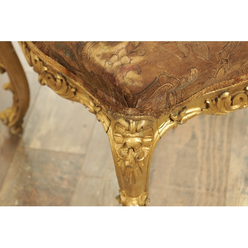 1305 - A SUITE OF FOUR CARVED GILTWOOD ROCOCO STYLE STOOLS comprising two window seats and two square stool... 