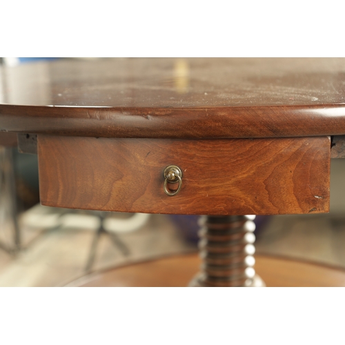 1309 - A RARE GEORGE II FIGURED MAHOGANY TWO-TIER REVOLVING TABLE the top with four frieze drawers above an... 