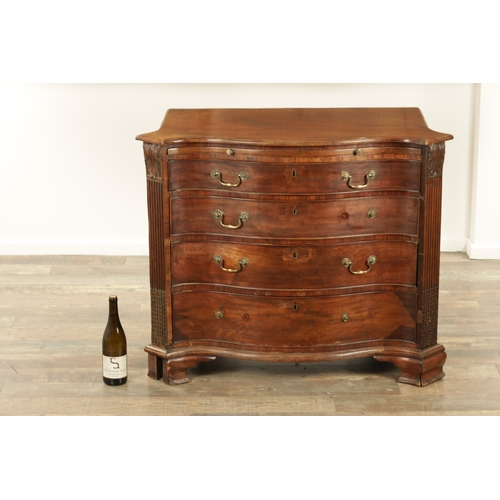 1312 - A GEORGE III MAHOGANY SERPENTINE CHEST OF DRAWERS with leaf-carved stop fluted corners enclosing a b... 