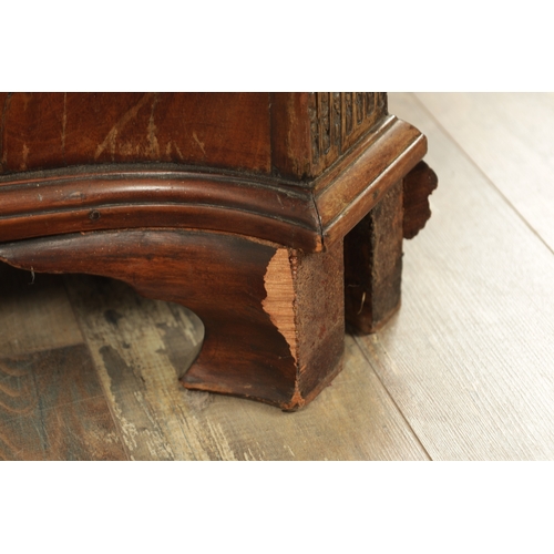 1312 - A GEORGE III MAHOGANY SERPENTINE CHEST OF DRAWERS with leaf-carved stop fluted corners enclosing a b... 