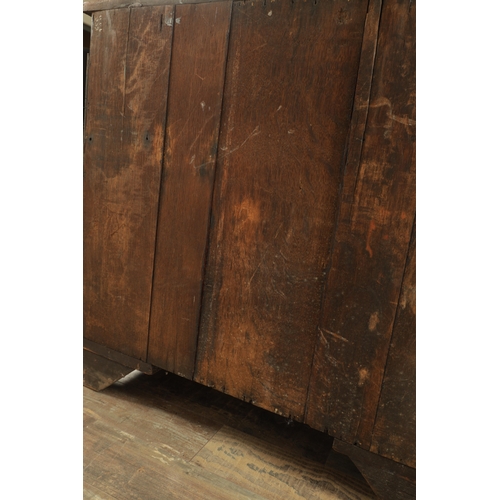 1312 - A GEORGE III MAHOGANY SERPENTINE CHEST OF DRAWERS with leaf-carved stop fluted corners enclosing a b... 