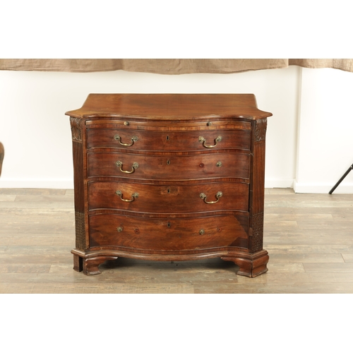 1312 - A GEORGE III MAHOGANY SERPENTINE CHEST OF DRAWERS with leaf-carved stop fluted corners enclosing a b... 