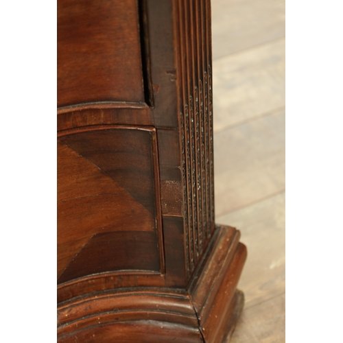 1312 - A GEORGE III MAHOGANY SERPENTINE CHEST OF DRAWERS with leaf-carved stop fluted corners enclosing a b... 