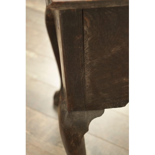 1316 - A GEORGE III OAK LOWBOY with a cross-banded top above three frieze drawers fitted with brass solid h... 