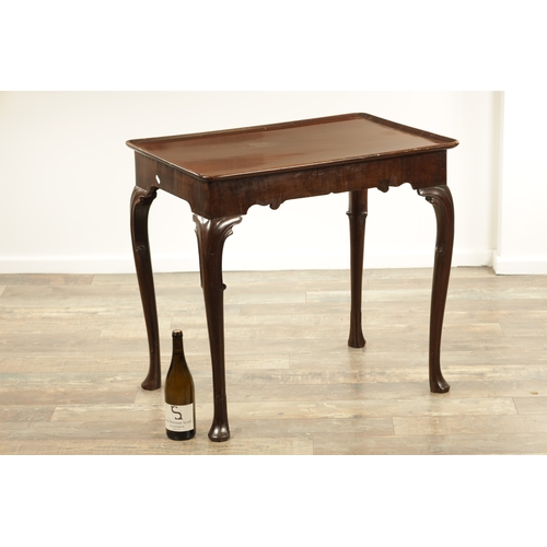 1317 - AN 18TH CENTURY MAHOGANY SILVER TABLE with a dished top above a shaped shallow frieze with slender c... 