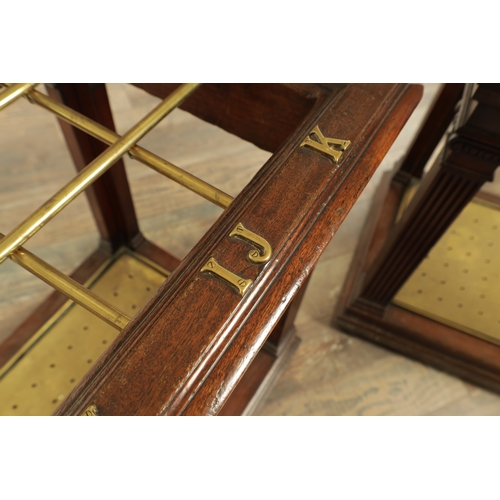 1320 - A GOOD PAIR OF 19TH CENTURY COUNTRY HOUSE WALNUT AND BRASS STICK STANDS having initials to the top r... 