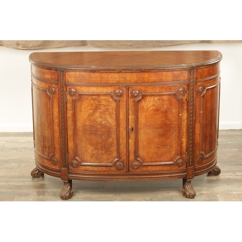 1322 - A 19TH CENTURY BOW FRONTED FIGURED ROSEWOOD SIDE CABINET with panelled front having two centre hinge... 