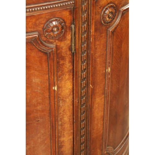 1322 - A 19TH CENTURY BOW FRONTED FIGURED ROSEWOOD SIDE CABINET with panelled front having two centre hinge... 