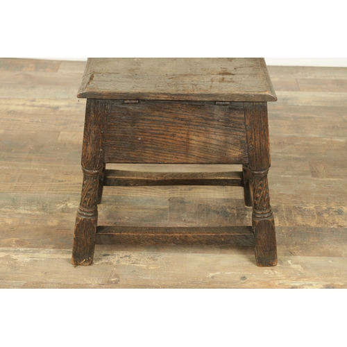 1323 - A 17TH CENTURY STYLE JOINED OAK BOX STOOL with a hinged top above a masked carved frieze raised on c... 