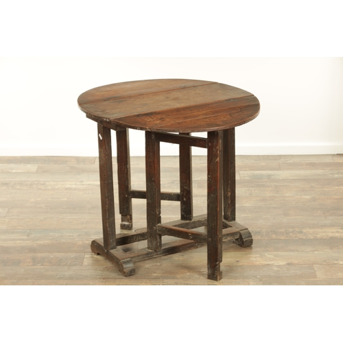 1324 - A 17TH CENTURY WALNUT GATE LEG TABLE OF SMALL SIZE with drop-down sides and joined base with hinged ... 